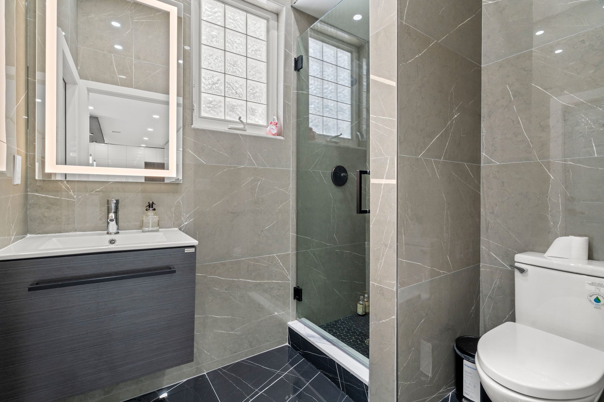 Gray marble bathroom with floating vanity